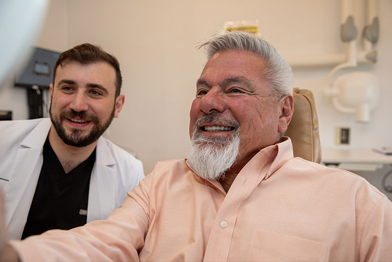 doctor and patient looking into mirror