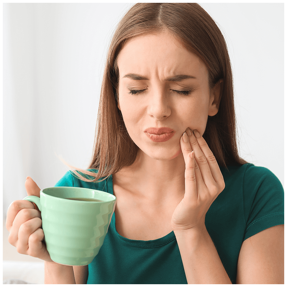 woman holding mouth in pain